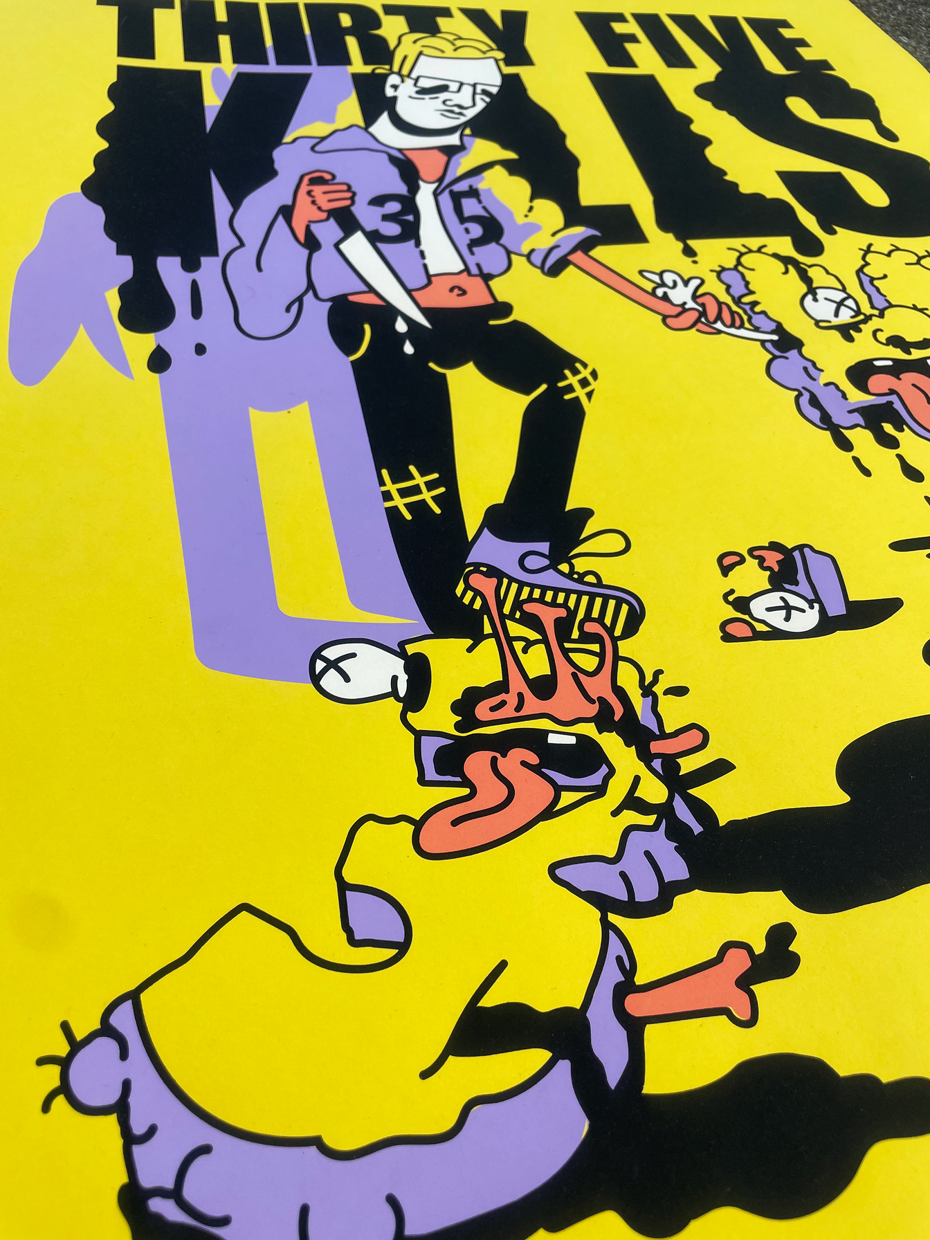 Angled close-up of the illustrated figures and screen-printed texture