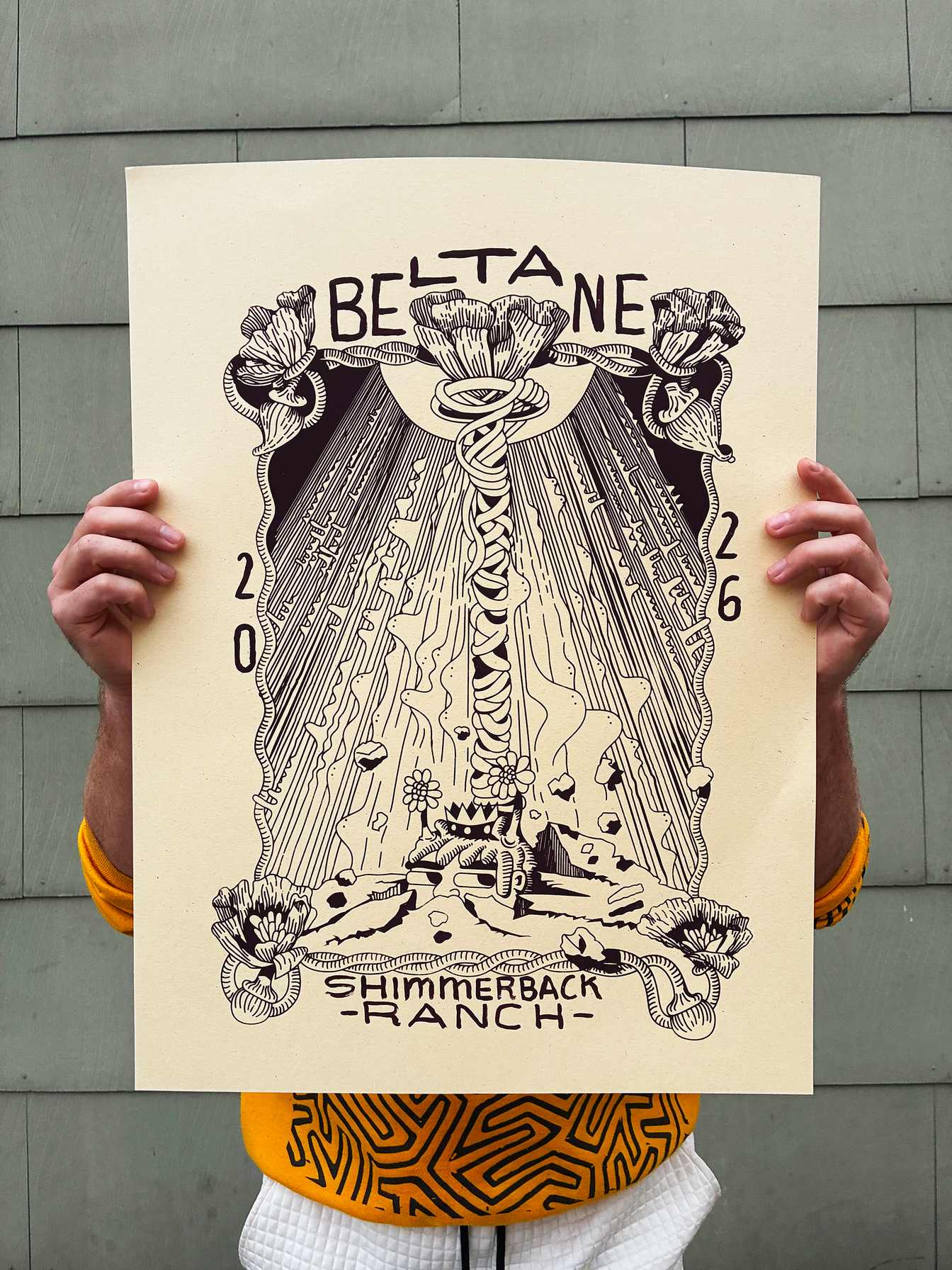 Lil Guppie holding the finished Shimmerback Ranch Beltane print